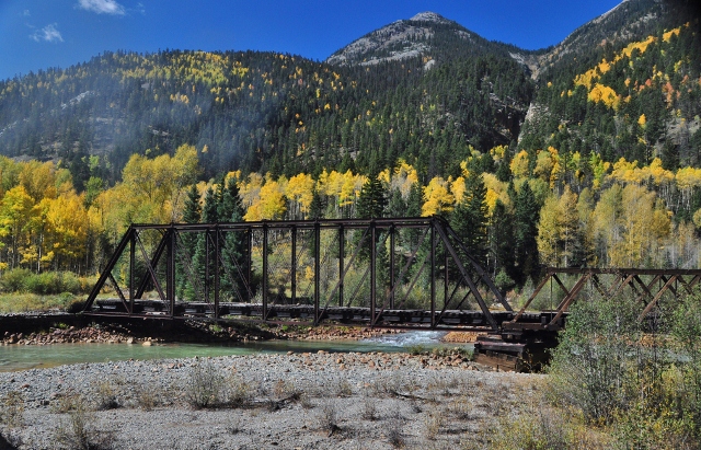 a train trellis across the Animas River